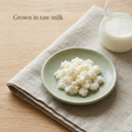 Raw-milk-grown kefir grains with sage pottery and a Grown in raw milk caption