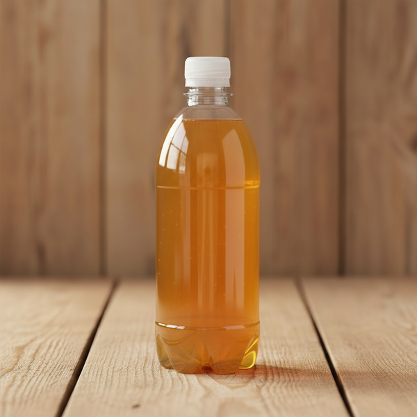 Starter tea bottle filled with golden kombucha