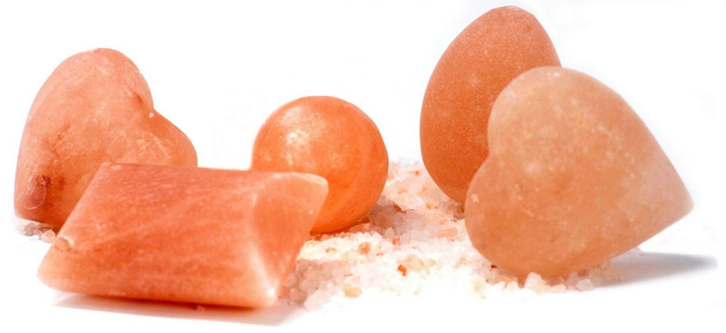 Assorted pink salt deodorant shapes, including two hearts, a ball, an egg and a rectangular bar
