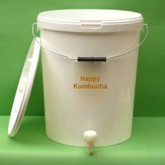 White brewing bucket with a metal carrying handle, white tap and detached lid leaning against its side